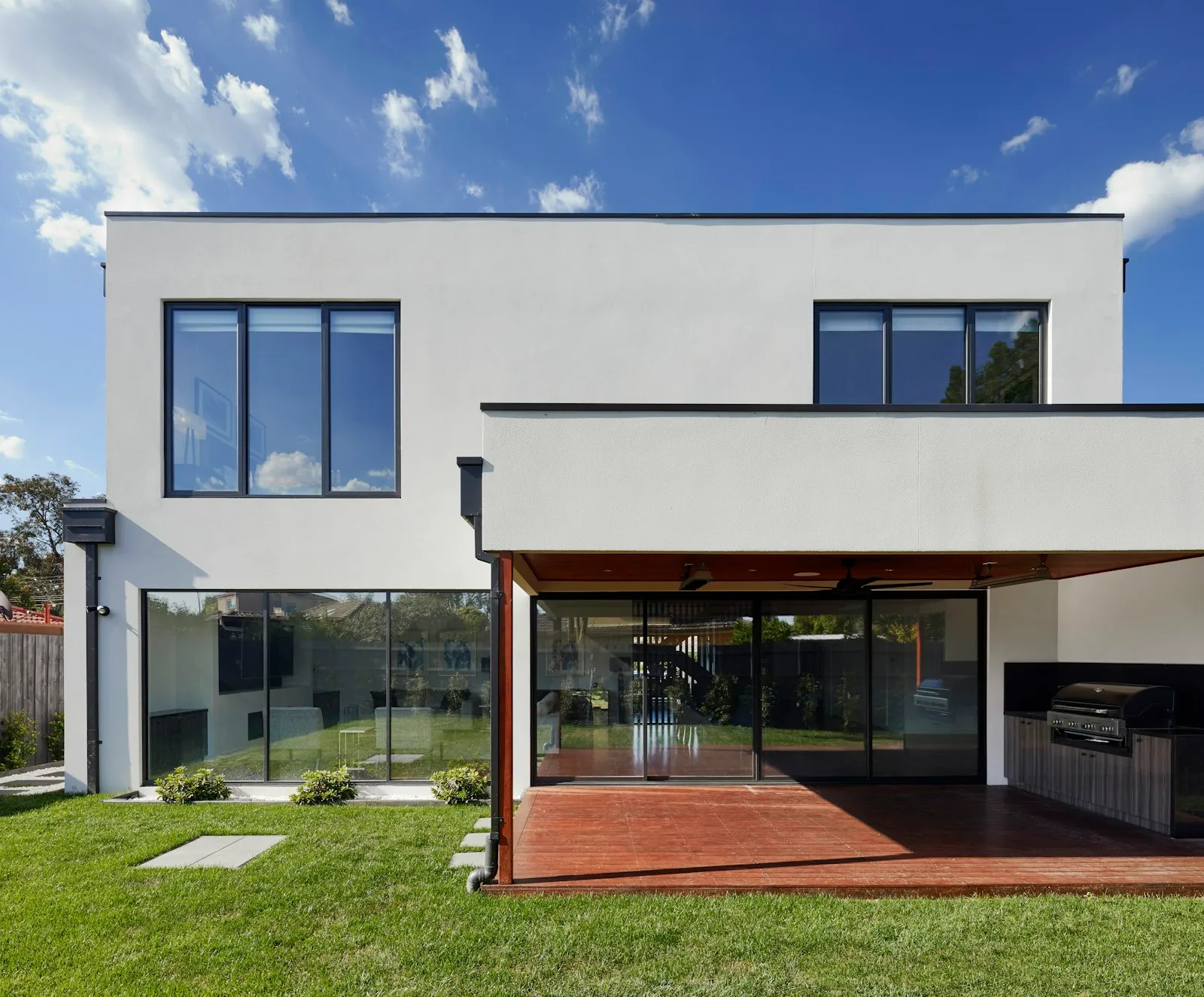 Luxury Hamptons estate exterior at golden hour